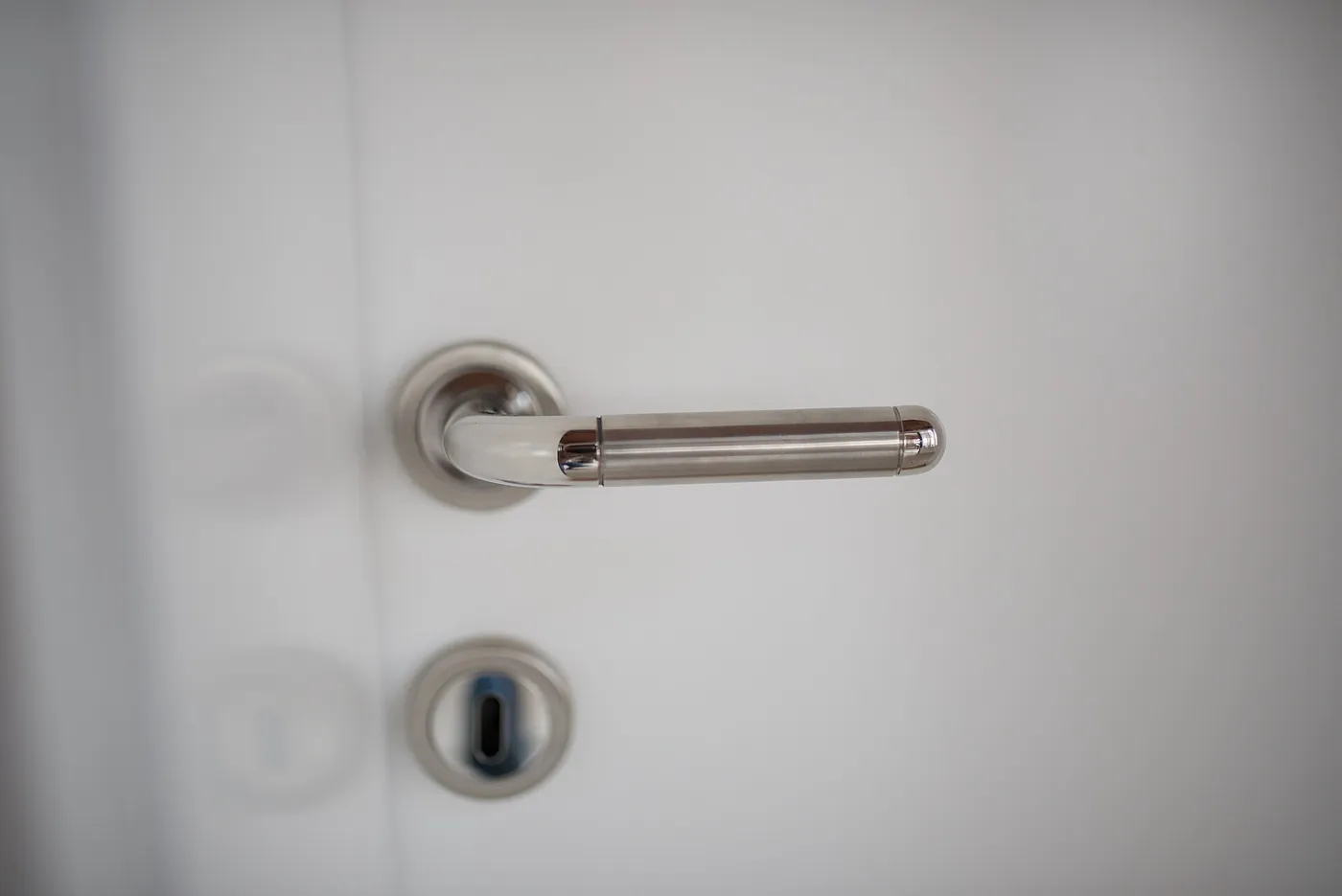 Close-up of a door handle and cylinder